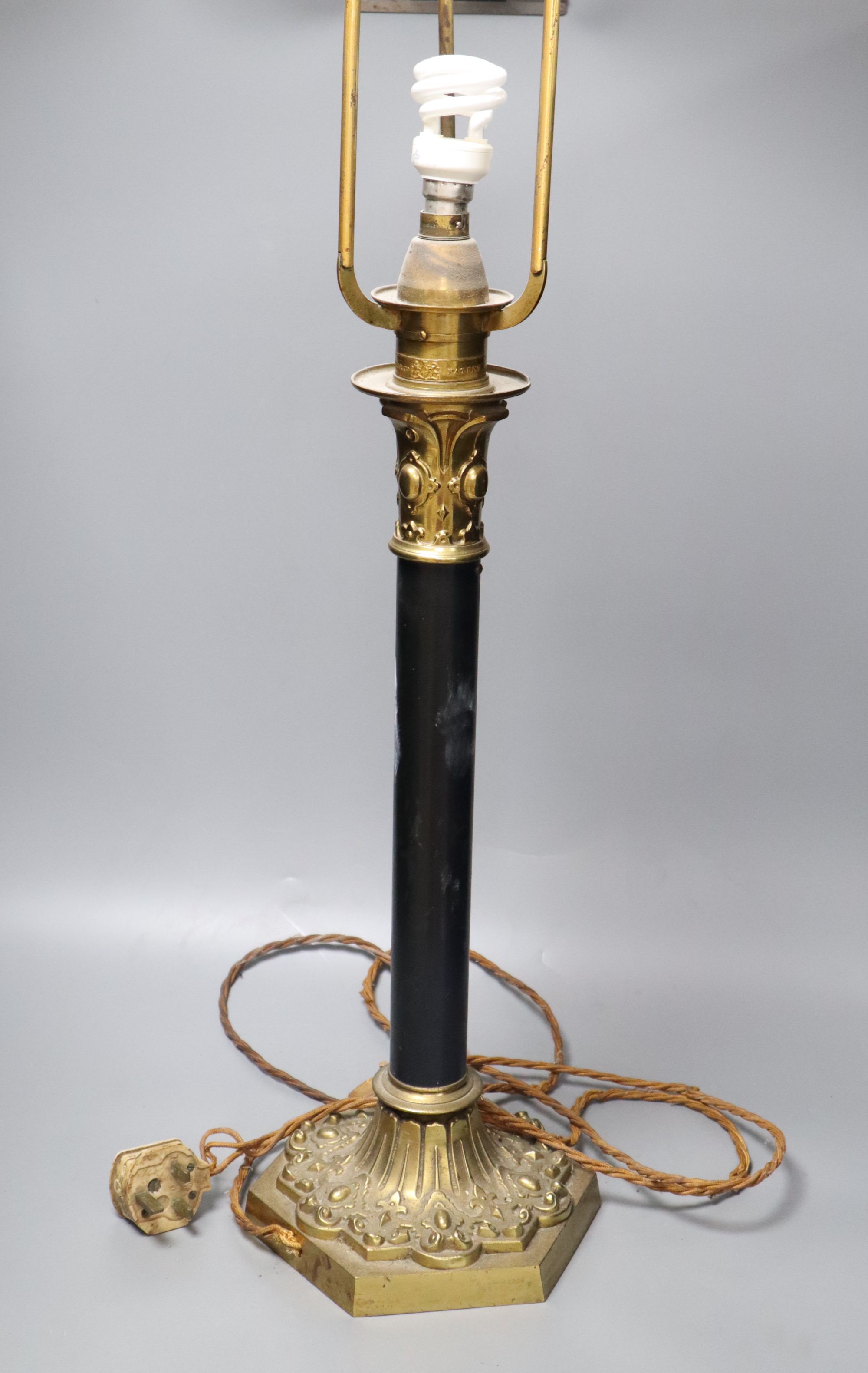 A brass and ebonised patented table lamp